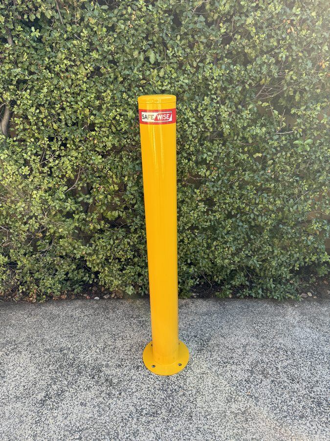 Fixed safety bollard installed on concrete